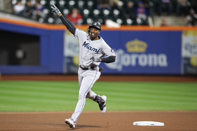 Sep 27, 2023; New York, NY, USA; Miami Marlins left fielder Bryan De La Cruz (14) runs the bases after his solo home run during the fourth inning against the New York Mets at Citi Field.  Mandatory Credit: Vincent Carchietta-USA TODAY Sports