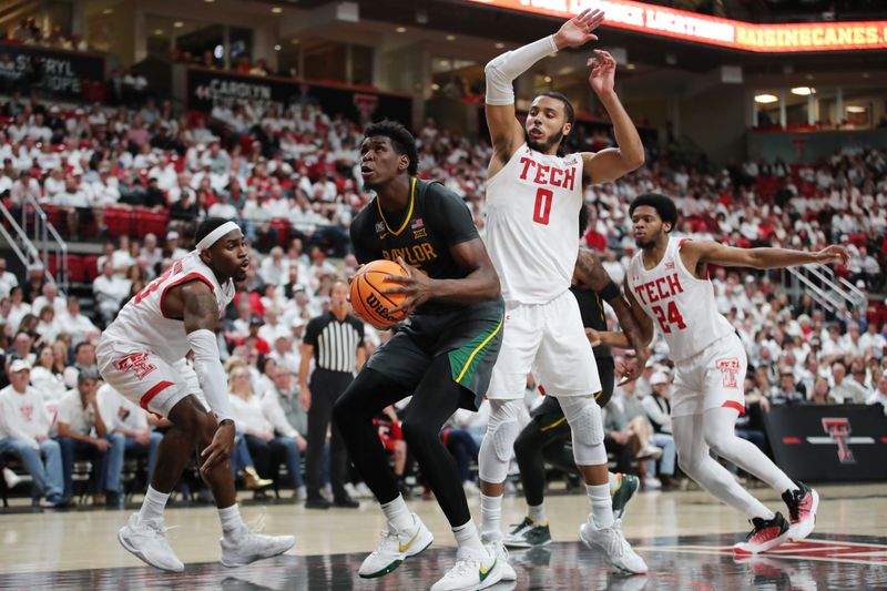 Jan 17, 2023; Lubbock, Texas, USA;  Baylor Bears forward Josh Ojianwuna (15) stops to shoot against Texas Tech Red Raiders forward Kevin Obanor (0) and guard De   Vion Harmon (23) in the second half at United Supermarkets Arena. Mandatory Credit: Michael C. Johnson-USA TODAY Sports