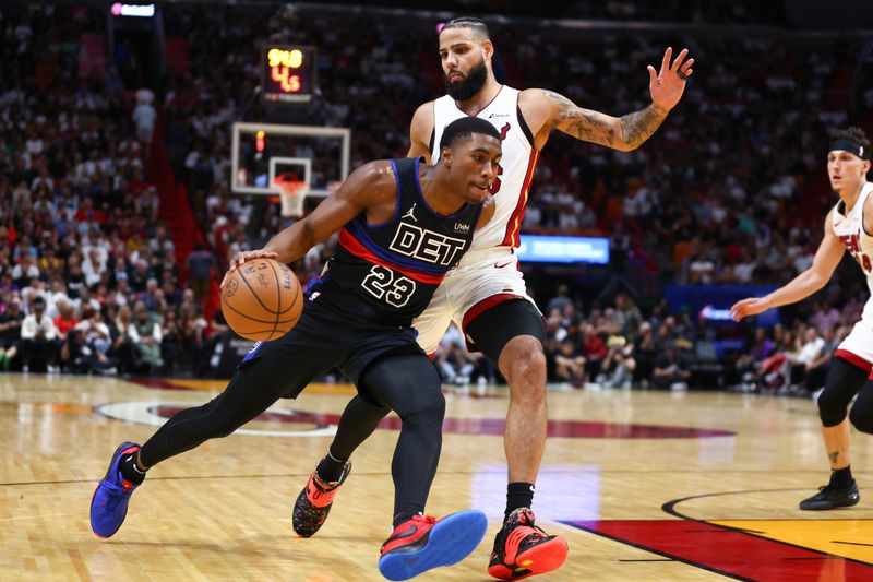 MIAMI, FLORIDA - OCTOBER 25: Jaden Ivey #23 of the Detroit Pistons drives against Caleb Martin #16 of the Miami Heat during the third quarter of the game at Kaseya Center on October 25, 2023 in Miami, Florida. NOTE TO USER: User expressly acknowledges and agrees that, by downloading and or using this photograph, User is consenting to the terms and conditions of the Getty Images License Agreement.  (Photo by Megan Briggs/Getty Images)