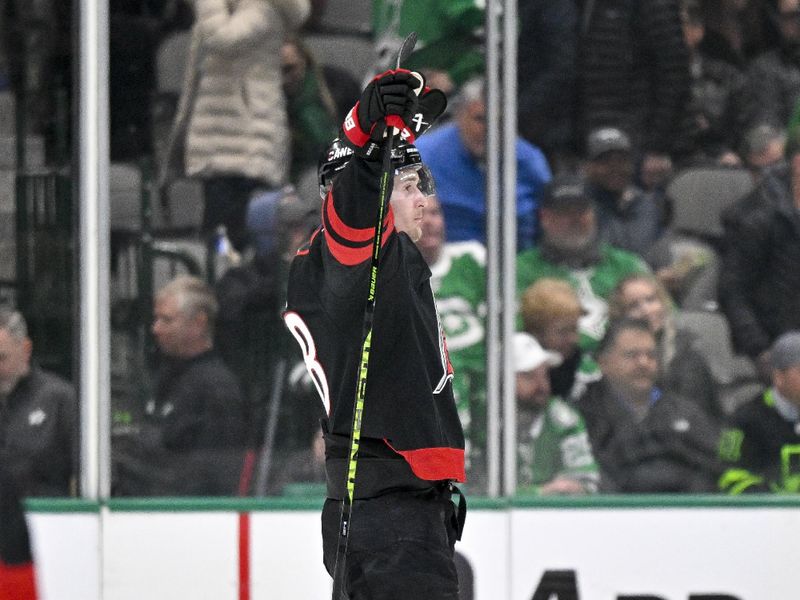 Jan 25, 2023; Dallas, Texas, USA; Carolina Hurricanes center Martin Necas (88) celebrates scoring the game winning goal against the Dallas Stars during the overtime period at the American Airlines Center. Mandatory Credit: Jerome Miron-USA TODAY Sports