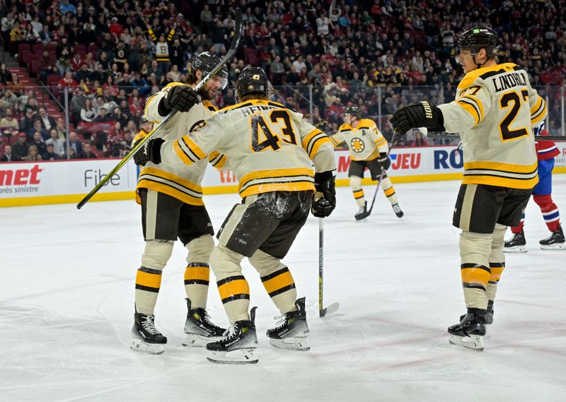 Mar 14, 2024; Montreal, Quebec, CAN; Boston Bruins forward Danton Heinen (43) celebrates with teammates after scoring a goal against the Montreal Canadiens during the first period at the Bell Centre. Mandatory Credit: Eric Bolte-USA TODAY Sports