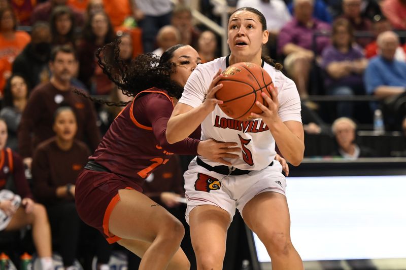 Mar 5, 2023; Greensboro, NC, USA; Louisville Cardinals guard Mykasa Robinson (5) is grabbed by Virginia Tech Hokies guard Kayana Traylor (23) on a shot during the first half at Greensboro Coliseum. Mandatory Credit: William Howard-USA TODAY Sports