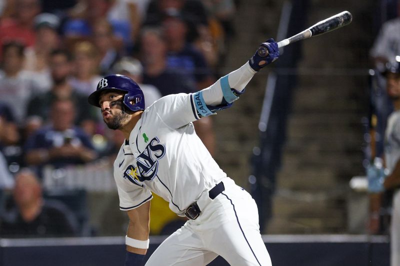 May 19, 2025; Tampa, Florida, USA; Tampa Bay Rays right fielder Jose Caballero (77) hits an rbi double against the Houston Astros in the sixth inning  at George M. Steinbrenner Field. Mandatory Credit: Nathan Ray Seebeck-Imagn Images