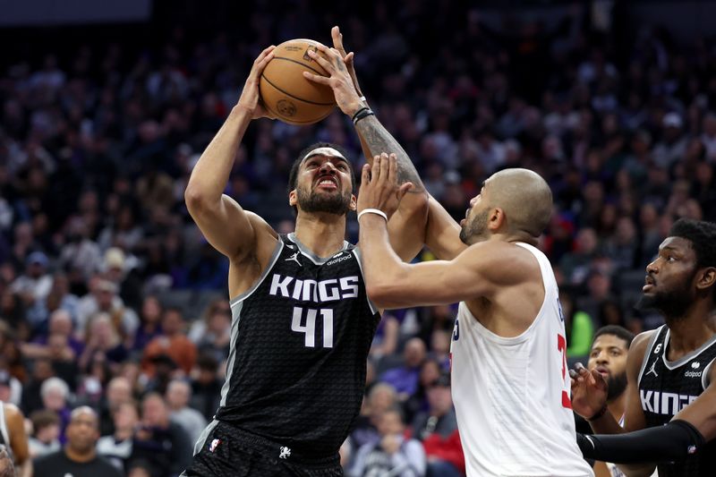 SACRAMENTO, CALIFORNIA - MARCH 03: Trey Lyles #41 of the Sacramento Kings goes up for a shot on Nicolas Batum #33 of the LA Clippers at Golden 1 Center on March 03, 2023 in Sacramento, California. NOTE TO USER: User expressly acknowledges and agrees that, by downloading and or using this photograph, User is consenting to the terms and conditions of the Getty Images License Agreement.   (Photo by Ezra Shaw/Getty Images)