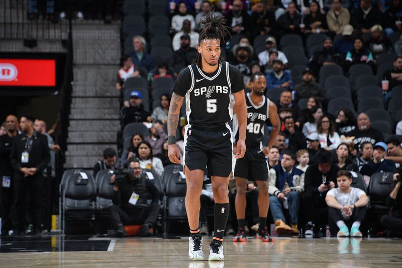 SAN ANTONIO, TX - DECEMBER 6:  Stephon Castle #5 of the San Antonio Spurs looks on during the game against the Sacramento Kings on December 6, 2024 at the Frost Bank Center in San Antonio, Texas. NOTE TO USER: User expressly acknowledges and agrees that, by downloading and or using this photograph, user is consenting to the terms and conditions of the Getty Images License Agreement. Mandatory Copyright Notice: Copyright 2024 NBAE (Photos by Michael Gonzales/NBAE via Getty Images)