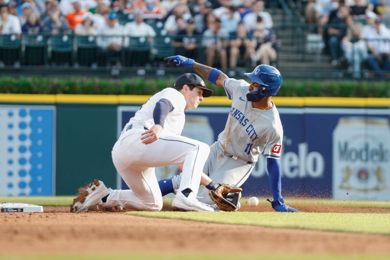 Apr 27, 2024; Detroit, Michigan, USA; Kansas City Royals third baseman Maikel Garcia (11) slides into second base during the second inning against the Detroit Tigers at Comerica Park. Mandatory Credit: Brian Bradshaw Sevald-USA TODAY Sports