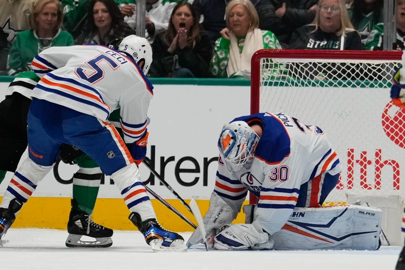 Feb 17, 2024; Dallas, Texas, USA; Edmonton Oilers goaltender Calvin Pickard (30) makes a save against the Dallas Stars during the first period at American Airlines Center. Mandatory Credit: Chris Jones-USA TODAY Sports