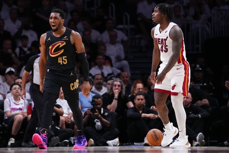 MIAMI, FLORIDA - APRIL 26: Donovan Mitchell #45 of the Cleveland Cavaliers reacts after forcing a foul against Davion Mitchell #45 of the Miami Heat during the second quarter in Game Three of the Eastern Conference First Round NBA Playoffs at Kaseya Center on April 26, 2025 in Miami, Florida. NOTE TO USER: User expressly acknowledges and agrees that, by downloading and or using this photograph, User is consenting to the terms and conditions of the Getty Images License Agreement. (Photo by Rich Storry/Getty Images)