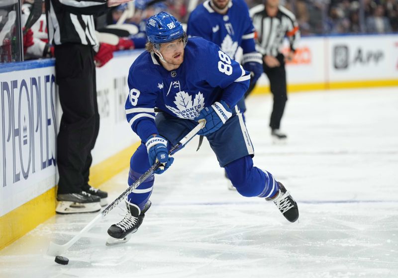 Mar 26, 2024; Toronto, Ontario, CAN; Toronto Maple Leafs right wing William Nylander (88) skates with the puck against the New Jersey Devils during the first period at Scotiabank Arena. Mandatory Credit: Nick Turchiaro-USA TODAY Sports