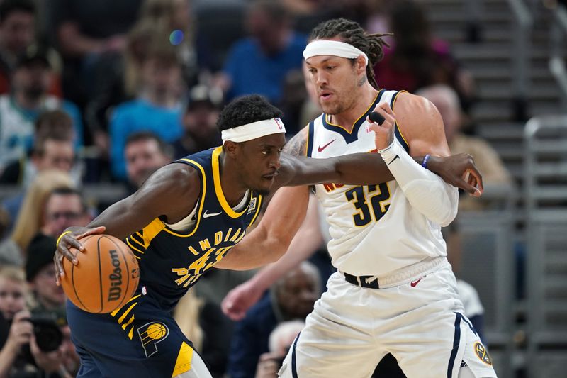 INDIANAPOLIS, INDIANA - FEBRUARY 24: Pascal Siakam #43 of the Indiana Pacers dribbles the ball while being guarded by Aaron Gordon #32 of the Denver Nuggets in the first half at Gainbridge Fieldhouse on February 24, 2025 in Indianapolis, Indiana. NOTE TO USER: User expressly acknowledges and agrees that, by downloading and or using this photograph, User is consenting to the terms and conditions of the Getty Images License Agreement. (Photo by Dylan Buell/Getty Images)