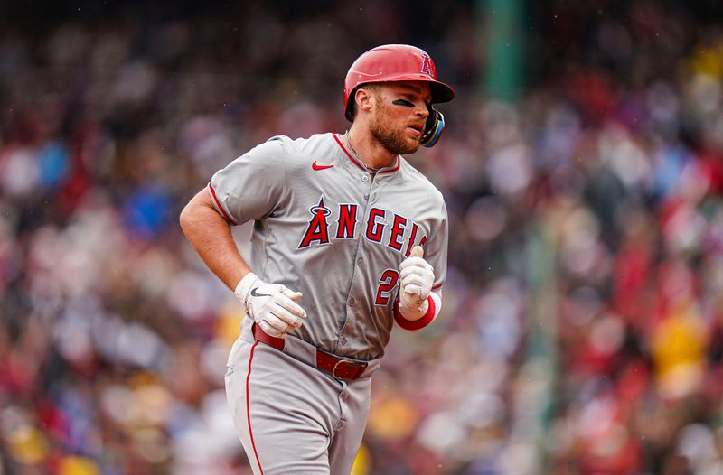 Apr 14, 2024; Boston, Massachusetts, USA; Los Angeles Angels second baseman Brandon Drury (23) hits a home run against the Boston Red Sox in the second inning at Fenway Park. Mandatory Credit: David Butler II-USA TODAY Sports