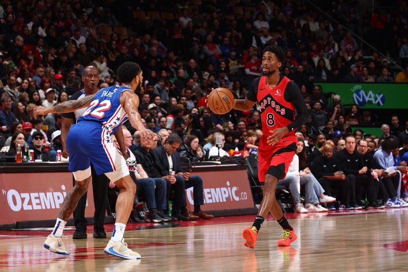 TORONTO, CANADA - MARCH 31: Kobi Simmons #8 of the Toronto Raptors dribbles the ball during the game against the Philadelphia 76ers on March 31, 2024 at the Scotiabank Arena in Toronto, Ontario, Canada.  NOTE TO USER: User expressly acknowledges and agrees that, by downloading and or using this Photograph, user is consenting to the terms and conditions of the Getty Images License Agreement.  Mandatory Copyright Notice: Copyright 2024 NBAE (Photo by Vaughn Ridley/NBAE via Getty Images)