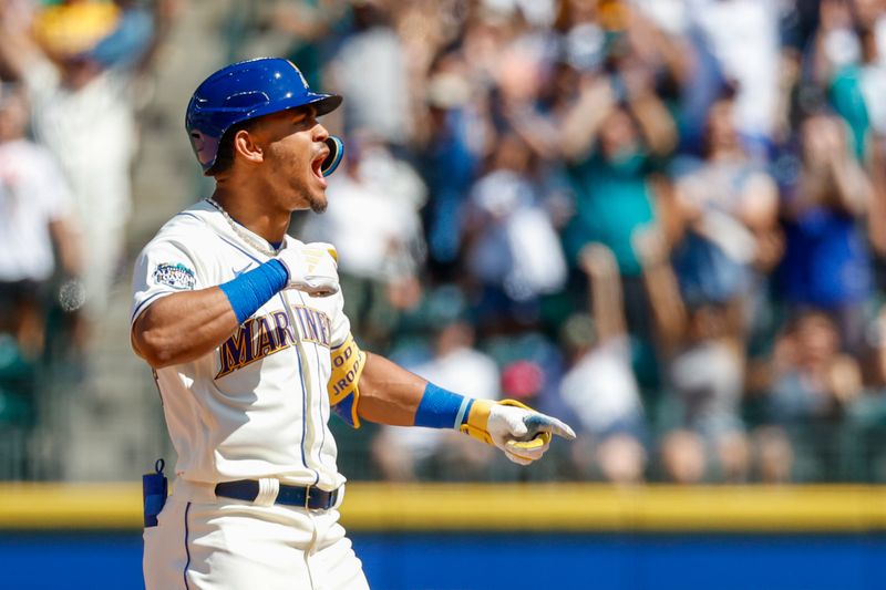 Aug 13, 2023; Seattle, Washington, USA; Seattle Mariners center fielder Julio Rodriguez (44) celebrates after hitting an RBI-double against the Baltimore Orioles during the fifth inning at T-Mobile Park. Mandatory Credit: Joe Nicholson-USA TODAY Sports