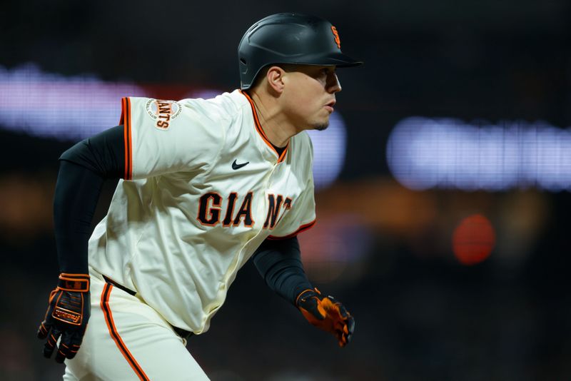 Apr 21, 2025; San Francisco, California, USA; San Francisco Giants designated hitter Wilmer Flores (41) hits a single during the eighth inning against the Milwaukee Brewers at Oracle Park. Mandatory Credit: Sergio Estrada-Imagn Images