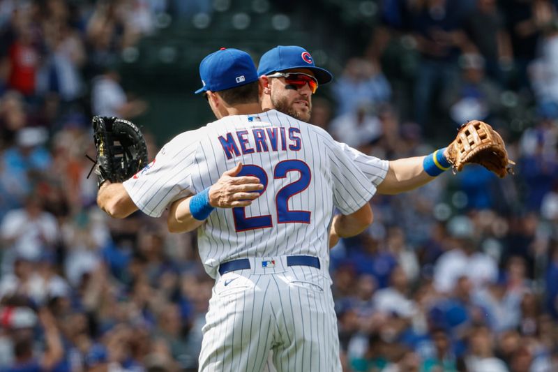 May 5, 2023; Chicago, Illinois, USA; Chicago Cubs first baseman Matt Mervis (22) celebrates with third baseman Patrick Wisdom (16) after the team's win against the Miami Marlins at Wrigley Field. Mandatory Credit: Kamil Krzaczynski-USA TODAY Sports