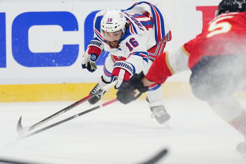 Jun 1, 2024; Sunrise, Florida, USA; New York Rangers center Vincent Trocheck (16) lunges for possession as Florida Panthers defenseman Aaron Ekblad (5) closes in during the first period in game six of the Eastern Conference Final of the 2024 Stanley Cup Playoffs at Amerant Bank Arena. Mandatory Credit: Jim Rassol-USA TODAY Sports