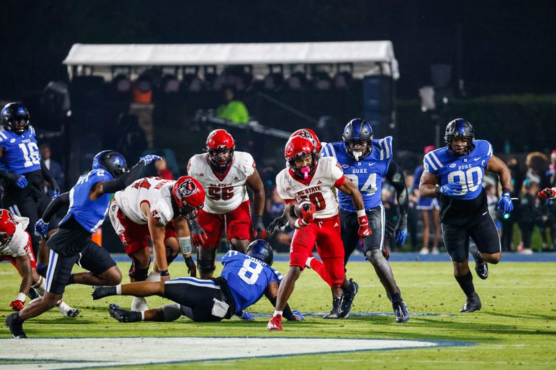 Oct 14, 2023; Durham, North Carolina, USA; North Carolina State Wolfpack wide receiver Kevin Concepcion (10) runs with the football during the first half of the game against Duke Blue Devils at Wallace Wade Stadium. Mandatory Credit: Jaylynn Nash-USA TODAY Sports