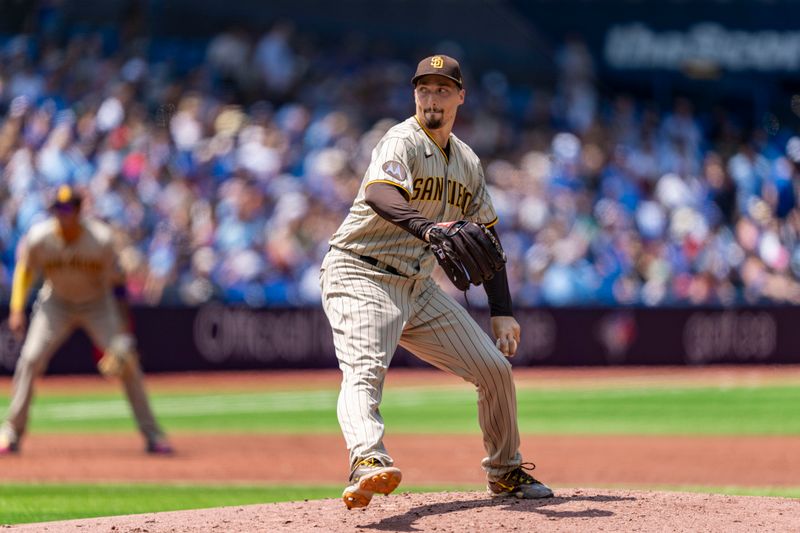 Jul 20, 2023; Toronto, Ontario, CAN; San Diego Padres starting pitcher Blake Snell (4) pitches to the Toronto Blue Jays during the second inning at Rogers Centre. Mandatory Credit: Kevin Sousa-USA TODAY Sports