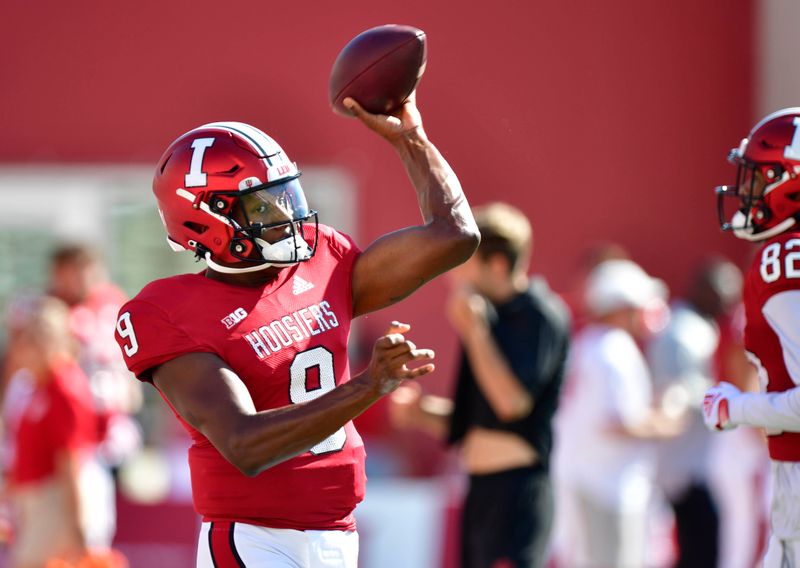 Sep 18, 2021; Bloomington, Indiana, USA; Indiana Hoosiers quarterback Michael Penix Jr. (9) warms up before the game against the Cincinnati Bearcats at Memorial Stadium. Mandatory Credit: Marc Lebryk-USA TODAY Sports