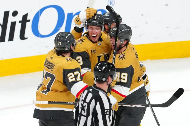 Mar 9, 2024; Las Vegas, Nevada, USA; Vegas Golden Knights defenseman Brayden McNabb (3) celebrates with team mates after scoring a goal against the Detroit Red Wings during the third period at T-Mobile Arena. Mandatory Credit: Stephen R. Sylvanie-USA TODAY Sports