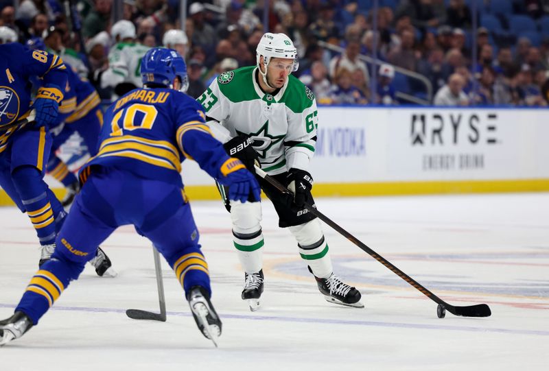 Oct 22, 2024; Buffalo, New York, USA;  Dallas Stars right wing Evgenii Dadonov (63) looks to make a pass as Buffalo Sabres defenseman Henri Jokiharju (10) defends during the first period at KeyBank Center. Mandatory Credit: Timothy T. Ludwig-Imagn Images