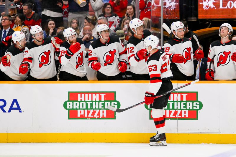 Mar 26, 2026; Nashville, Tennessee, USA;  New Jersey Devils left wing Jesper Bratt (63) celebrates with his teammates after scoring a goal against the Nashville Predators during the second period at Bridgestone Arena. Mandatory Credit: Steve Roberts-Imagn Images