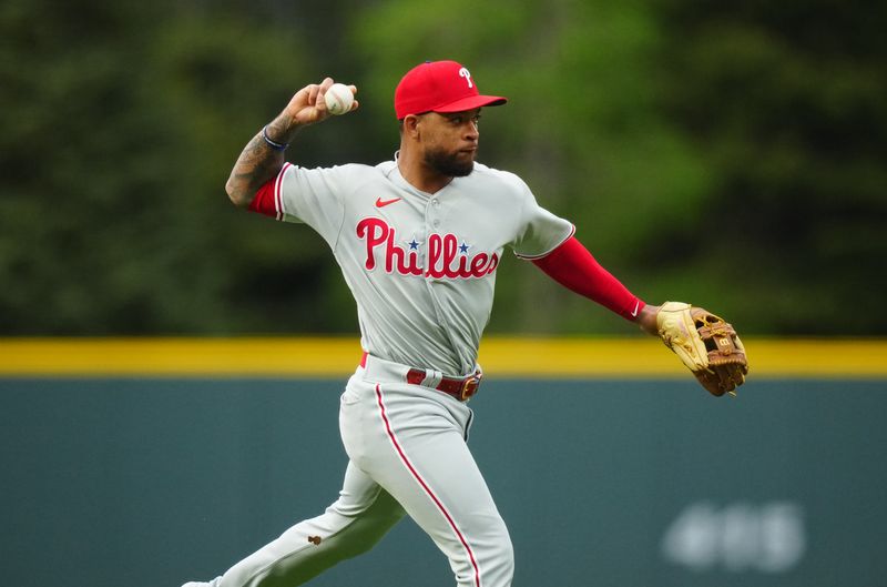 May 12, 2023; Denver, Colorado, USA; Philadelphia Phillies third baseman Edmundo Sosa (33) fields the ball in the first inning against the Colorado Rockies at Coors Field. Mandatory Credit: Ron Chenoy-USA TODAY Sports