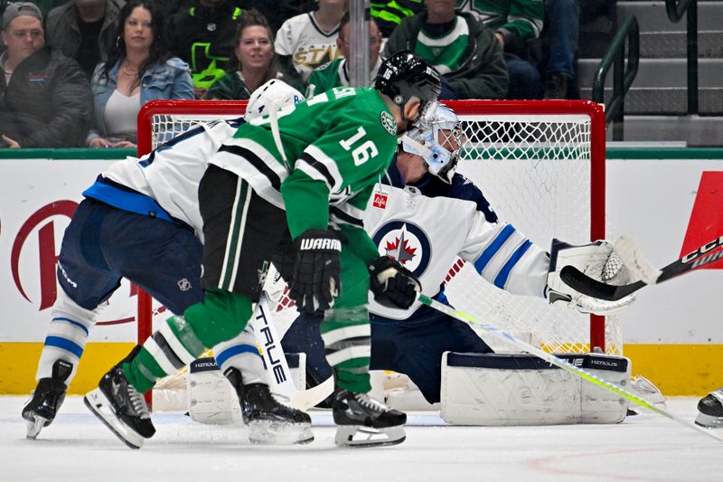 Feb 29, 2024; Dallas, Texas, USA; Dallas Stars center Joe Pavelski (16) scores a goal past Winnipeg Jets goaltender Connor Hellebuyck (37) during the first period at the American Airlines Center. Mandatory Credit: Jerome Miron-USA TODAY Sports