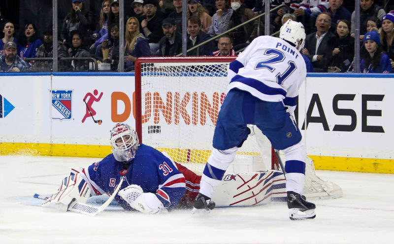 Apr 5, 2023; New York, New York, USA; New York Rangers goalie Igor Shesterkin (31) makes a kick save on a shot by Tampa Bay Lightning center Brayden Point (21) during the second period at Madison Square Garden. Mandatory Credit: Danny Wild-USA TODAY Sports