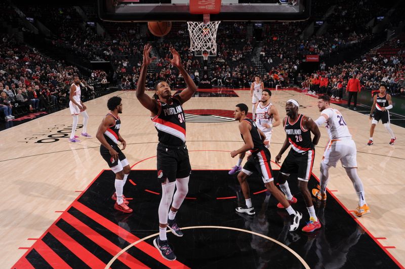 PORTLAND, OR - JANUARY 14: Jabari Walker #34 of the Portland Trail Blazers rebounds the ball during the game against the Phoenix Suns on January 14, 2024 at the Moda Center Arena in Portland, Oregon. NOTE TO USER: User expressly acknowledges and agrees that, by downloading and or using this photograph, user is consenting to the terms and conditions of the Getty Images License Agreement. Mandatory Copyright Notice: Copyright 2024 NBAE (Photo by Cameron Browne/NBAE via Getty Images)