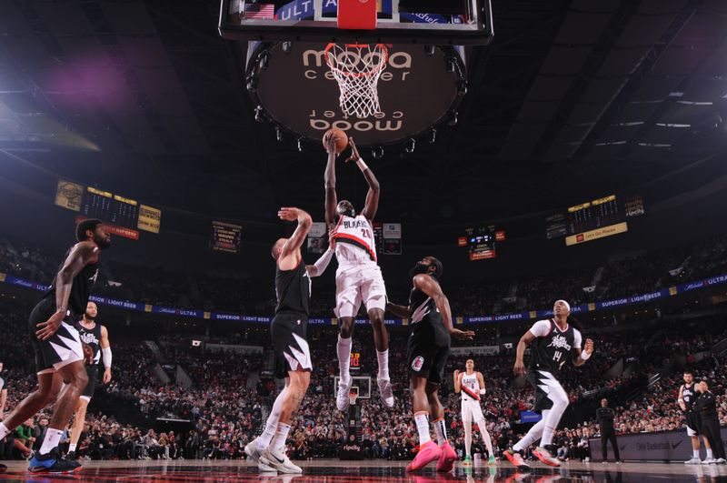 PORTLAND, OR - MARCH 22:  Duop Reath #26 of the Portland Trail Blazers goes to the basket during the game on March 22, 2024 at the Moda Center Arena in Portland, Oregon. NOTE TO USER: User expressly acknowledges and agrees that, by downloading and or using this photograph, user is consenting to the terms and conditions of the Getty Images License Agreement. Mandatory Copyright Notice: Copyright 2024 NBAE (Photo by Cameron Browne/NBAE via Getty Images)