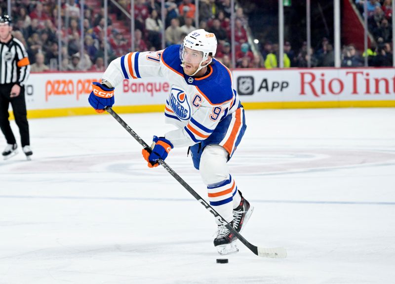 Jan 13, 2024; Montreal, Quebec, CAN; Edmonton Oilers forward Connor McDavid (97) plays the puck during the third period of the game against the Montreal Canadiens at the Bell Centre. Mandatory Credit: Eric Bolte-USA TODAY Sports