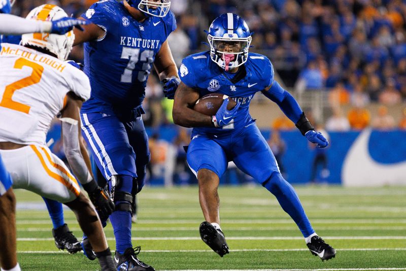 Oct 28, 2023; Lexington, Kentucky, USA; Kentucky Wildcats running back Ray Davis (1) carries the ball during the fourth quarter against the Tennessee Volunteers at Kroger Field. Mandatory Credit: Jordan Prather-USA TODAY Sports