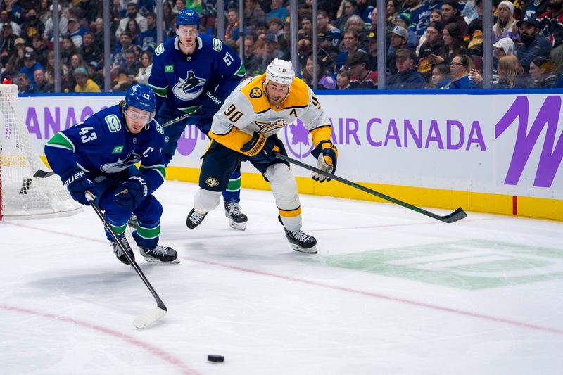 Nov 17, 2024; Vancouver, British Columbia, CAN; Vancouver Canucks defenseman Tyler Myers (57) watches as defenseman Quinn Hughes (43) and Nashville Predators forward Ryan O'Reilly (90) skate after the loose puck during the second period at Rogers Arena. Mandatory Credit: Bob Frid-Imagn Images