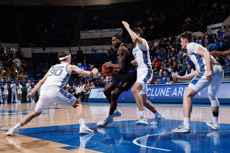 Mar 4, 2023; Colorado Springs, Colorado, USA; San Jose State Spartans guard Omari Moore (10) controls the ball under pressure from Air Force Falcons forward Beau Becker (14) and guard Camden Vander Zwaag (30) as guard Carter Murphy (4) defends in the first half at Clune Arena. Mandatory Credit: Isaiah J. Downing-USA TODAY Sports