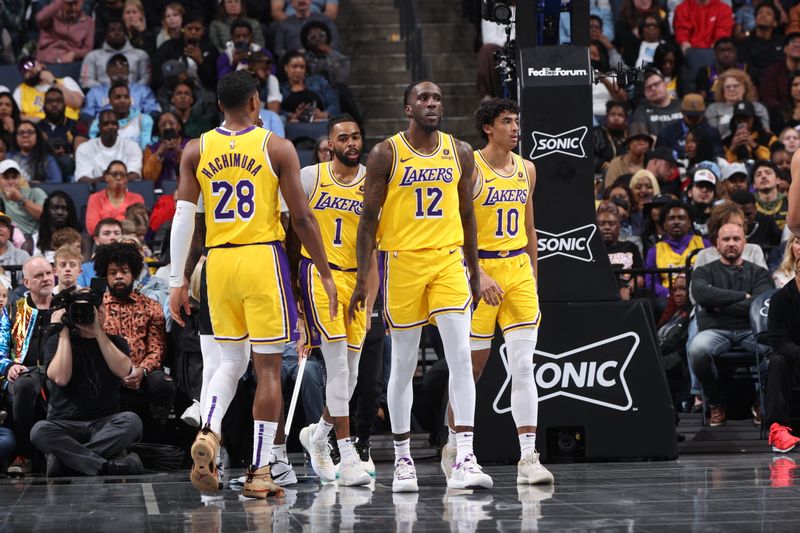 MEMPHIS, TN - MARCH 27: Rui Hachimura #28 of the Los Angeles Lakers, D'Angelo Russell #1 of the Los Angeles Lakers, Taurean Prince #12 of the Los Angeles Lakers and Max Christie #10 of the Los Angeles Lakers look on during the game against the Memphis Grizzlies on March 27, 2024 at FedExForum in Memphis, Tennessee. NOTE TO USER: User expressly acknowledges and agrees that, by downloading and or using this photograph, User is consenting to the terms and conditions of the Getty Images License Agreement. Mandatory Copyright Notice: Copyright 2024 NBAE (Photo by Joe Murphy/NBAE via Getty Images)