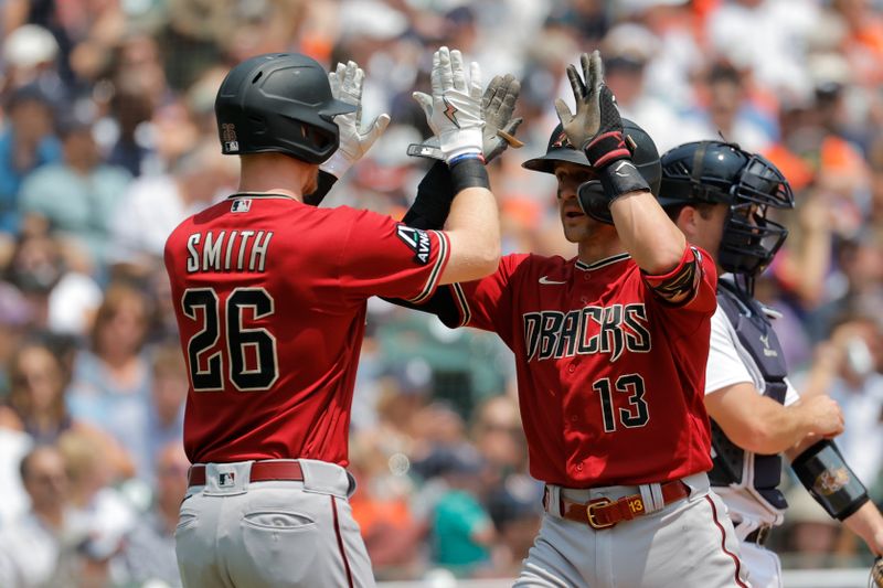 Jun 10, 2023; Detroit, Michigan, USA;  Arizona Diamondbacks shortstop Nick Ahmed (13) is congratulated by designated hitter Pavin Smith (26) after hitting a two-run home run in the second inning against the Detroit Tigers at Comerica Park. Mandatory Credit: Rick Osentoski-USA TODAY Sports