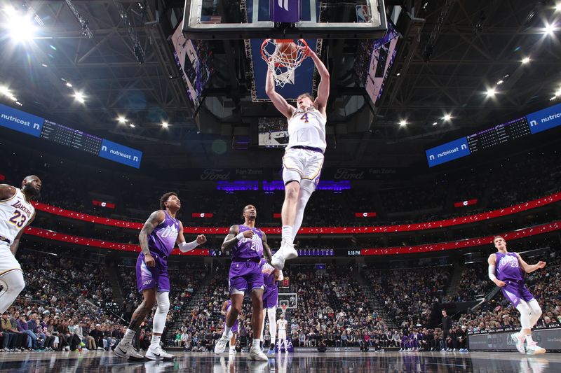 SALT LAKE CITY, UT - DECEMBER 1: Dalton Knecht #4 of the Los Angeles Lakers dunks the ball during the game against the Utah Jazz on December 1, 2024 at Delta Center in Salt Lake City, Utah. NOTE TO USER: User expressly acknowledges and agrees that, by downloading and or using this Photograph, User is consenting to the terms and conditions of the Getty Images License Agreement. Mandatory Copyright Notice: Copyright 2024 NBAE (Photo by Melissa Majchrzak/NBAE via Getty Images)