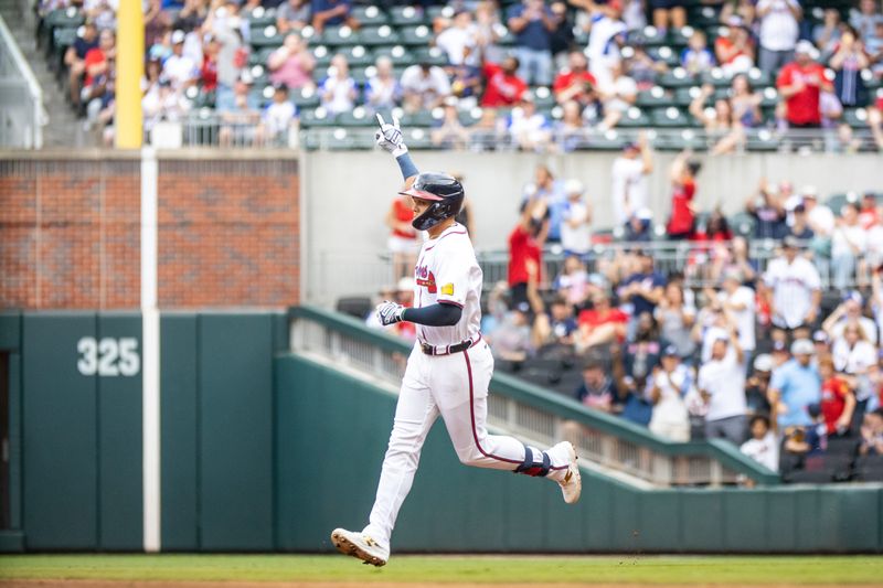 Sep 29, 2024; Cumberland, Georgia, USA; Atlanta Braves third base Gio Urshela (9) runs the bases after hitting a home run to left field against the Kansas City Royals during the third inning at Truist Park. Mandatory Credit: Jordan Godfree-Imagn Images