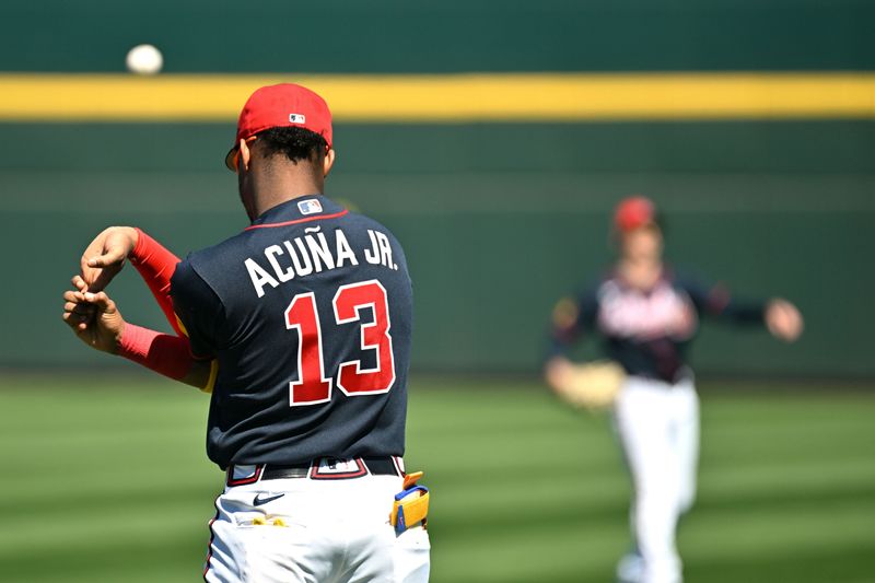 Feb 24, 2026; North Port, Florida, USA; Atlanta Braves right fielder Ronald Acuna Jr. (13) stretches before the game against the Detroit Tigers during spring training at CoolToday Park. Mandatory Credit: Jonathan Dyer-Imagn Images