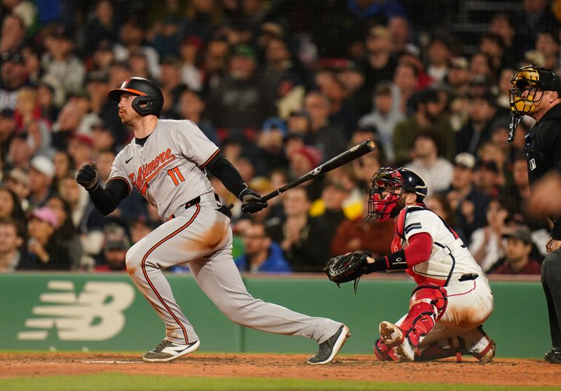 Apr 10, 2024; Boston, Massachusetts, USA;Baltimore Orioles third baseman Jordan Westburg (11) hits a three run home run against the Boston Red Sox in the seventh inning at Fenway Park. Mandatory Credit: David Butler II-USA TODAY Sports