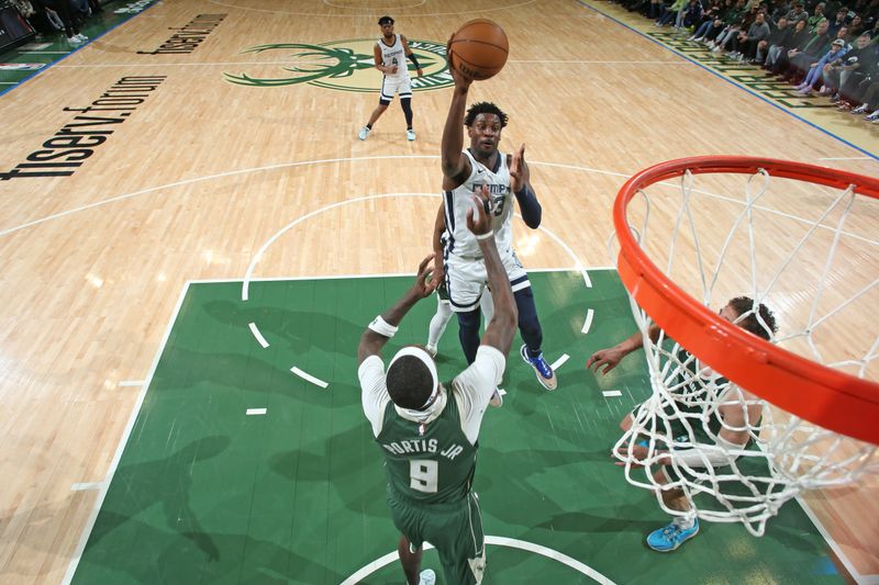 MILWAUKEE, WI - APRIL 3: Jaren Jackson Jr. #13 of the Memphis Grizzlies shoots the ball during the game against the Milwaukee Bucks on April 3, 2024 at the Fiserv Forum Center in Milwaukee, Wisconsin. NOTE TO USER: User expressly acknowledges and agrees that, by downloading and or using this Photograph, user is consenting to the terms and conditions of the Getty Images License Agreement. Mandatory Copyright Notice: Copyright 2024 NBAE (Photo by Gary Dineen/NBAE via Getty Images).