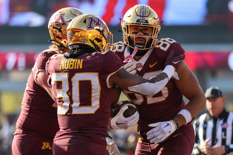 Nov 4, 2023; Minneapolis, Minnesota, USA; Minnesota Golden Gophers tight end Brevyn Spann-Ford (88) celebrates his touchdown with running back Jordan Nubin (30) during the first half against the Illinois Fighting Illini at Huntington Bank Stadium. Mandatory Credit: Matt Krohn-USA TODAY Sports