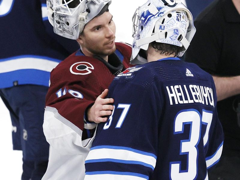 Apr 30, 2024; Winnipeg, Manitoba, CAN; Winnipeg Jets goaltender Connor Hellebuyck (37) congratulates Colorado Avalanche goaltender Alexandar Georgiev (40) in game five of the first round of the 2024 Stanley Cup Playoffs at Canada Life Centre. Mandatory Credit: James Carey Lauder-USA TODAY Sports