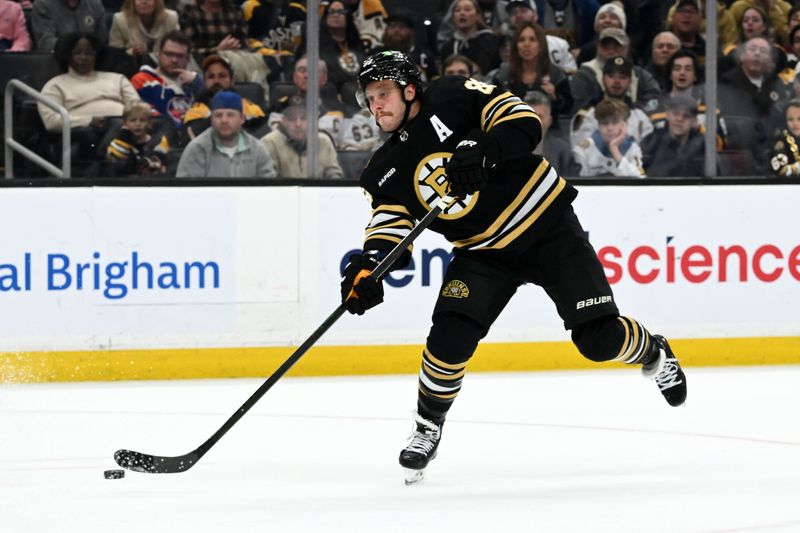 Nov 9, 2023; Boston, Massachusetts, USA; Boston Bruins right wing David Pastrnak (88) takes a shot against the New York Islanders during the third period at the TD Garden. Mandatory Credit: Brian Fluharty-USA TODAY Sports