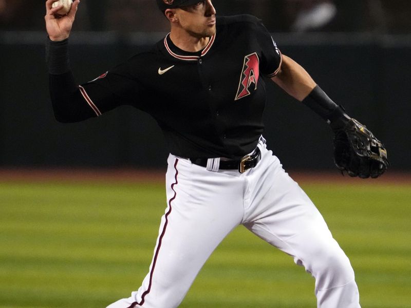 May 9, 2023; Phoenix, Arizona, USA; Arizona Diamondbacks shortstop Nick Ahmed (13) throws to first base against the Miami Marlins during the fifth inning at Chase Field. Mandatory Credit: Joe Camporeale-USA TODAY Sports