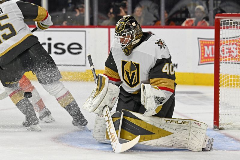 Dec 11, 2025; Philadelphia, Pennsylvania, USA; Vegas Golden Knights goaltender Akira Schmid (40) makes a save against the Philadelphia Flyers during the first period at Xfinity Mobile Arena. Mandatory Credit: Eric Hartline-Imagn Images