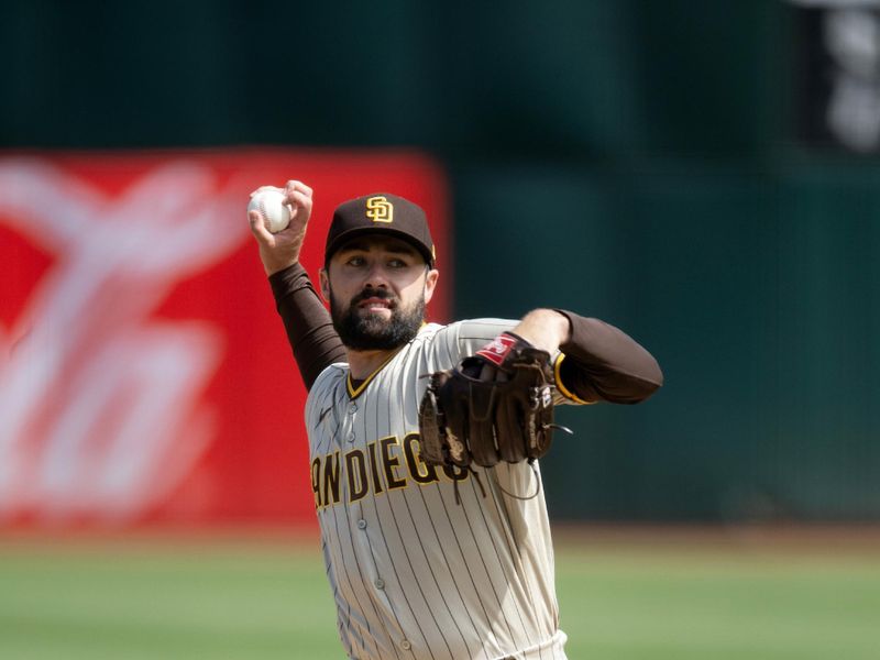 Sep 16, 2023; Oakland, California, USA; San Diego Padres starting pitcher Matt Waldron (61) pitches against the Oakland Athletics during the first inning at Oakland-Alameda County Coliseum. Mandatory Credit: D. Ross Cameron-USA TODAY Sports