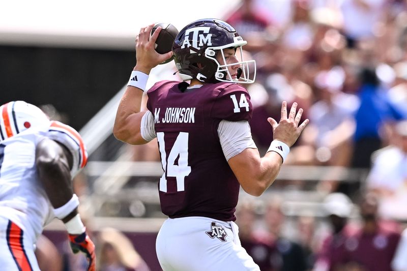 Sep 23, 2023; College Station, Texas, USA; Texas A&M Aggies quarterback Max Johnson (14) throws a pass during the third quarter against the Auburn Tigers at Kyle Field. Mandatory Credit: Maria Lysaker-USA TODAY Sports