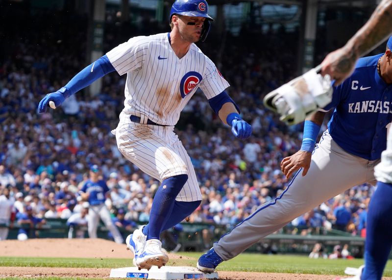 Aug 19, 2023; Chicago, Illinois, USA; Chicago Cubs second baseman Nico Hoerner (2) hits an infield single and is safe at first base against the Kansas City Royals during the fourth inningat Wrigley Field. Mandatory Credit: David Banks-USA TODAY Sports